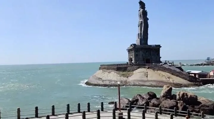 Coastal monument rising from rocks beside the sea