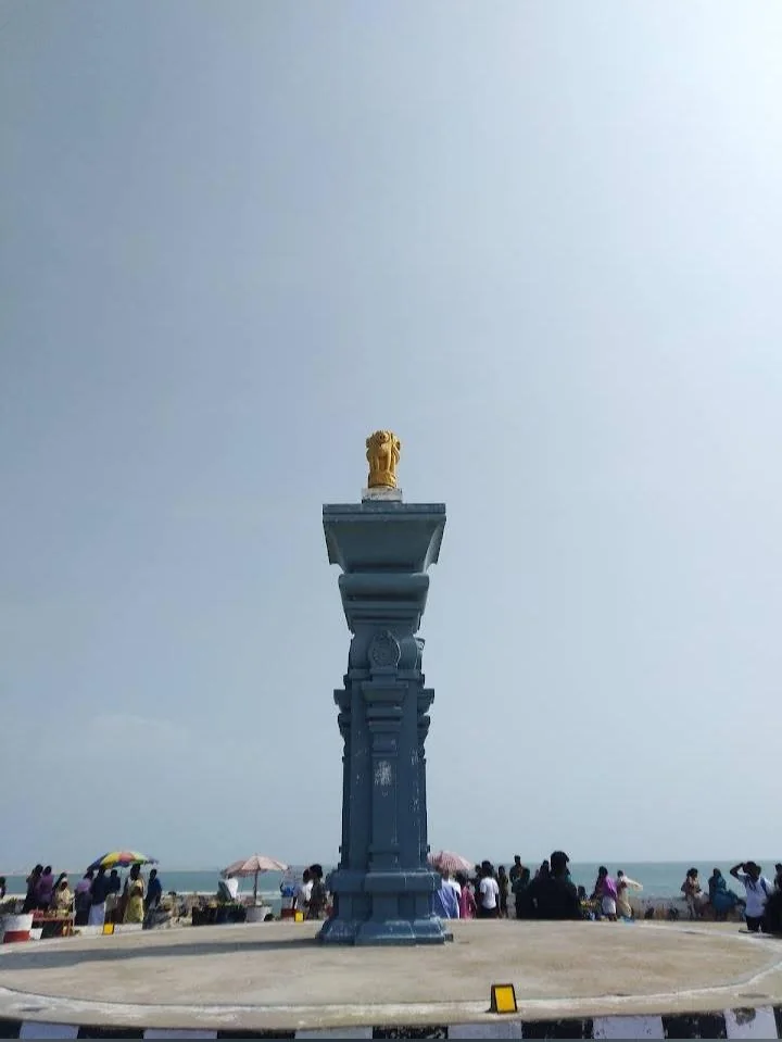 Tall landmark monument photographed under a cloudy sky